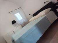 Posteľ alebo postele v izbe v ubytovaní Casa Santa Chiara