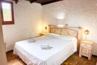 A bed or beds in a room at Villetta Rustica