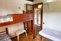 A bed or beds in a room at Villetta Rustica