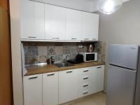 Kuchyňa alebo kuchynka v ubytovaní Cozy Apartment in the Heart of Thessaloniki