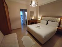 Posteľ alebo postele v izbe v ubytovaní Cozy Apartment in the Heart of Thessaloniki