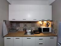 Kuchyňa alebo kuchynka v ubytovaní Cozy Apartment in the Heart of Thessaloniki