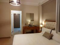 Posteľ alebo postele v izbe v ubytovaní Cozy Apartment in the Heart of Thessaloniki