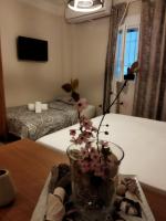 Posteľ alebo postele v izbe v ubytovaní Cozy Apartment in the Heart of Thessaloniki