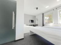 Posteľ alebo postele v izbe v ubytovaní Bell's Hotel