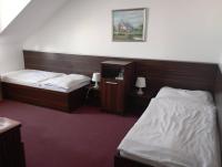 Posteľ alebo postele v izbe v ubytovaní Hotel Barbakan