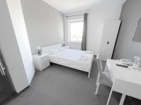 Posteľ alebo postele v izbe v ubytovaní Bell's Hotel