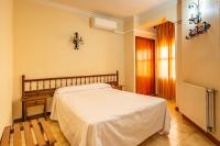 Postel nebo postele na pokoji v ubytování Hostal Hilaria