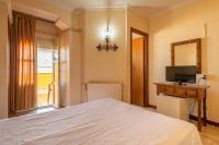 Postel nebo postele na pokoji v ubytování Hostal Hilaria