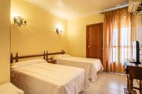 Postel nebo postele na pokoji v ubytování Hostal Hilaria