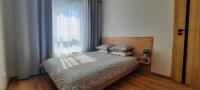 Posteľ alebo postele v izbe v ubytovaní Asti Apartamenty Centrum Stargard