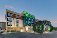 a hotel with a sign on the front of it at Holiday Inn Mobile Airport by IHG in Mobile