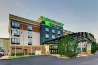 a hotel with a sign on the front of it at Holiday Inn Mobile Airport by IHG in Mobile