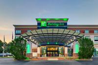 a hotel front entrance to a holiday inn at Holiday Inn Mobile Airport by IHG in Mobile