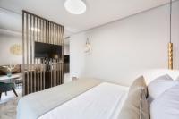 Posteľ alebo postele v izbe v ubytovaní Evitel Luxury Living