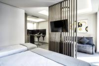 Televízia a/alebo spoločenská miestnosť v ubytovaní Evitel Luxury Living