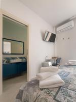 Posteľ alebo postele v izbe v ubytovaní Camere Casa Azzurra