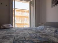 Posteľ alebo postele v izbe v ubytovaní Camere Casa Azzurra