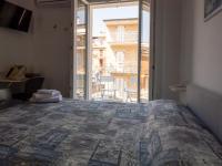 Posteľ alebo postele v izbe v ubytovaní Camere Casa Azzurra