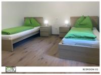 A bed or beds in a room at ACO Living - A cool Overnight