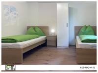 A bed or beds in a room at ACO Living - A cool Overnight