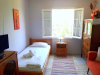 Posteľ alebo postele v izbe v ubytovaní Grandmas Cottage