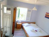 Posteľ alebo postele v izbe v ubytovaní Grandmas Cottage