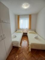 Posteľ alebo postele v izbe v ubytovaní Apartments Amor