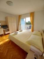 Posteľ alebo postele v izbe v ubytovaní Apartments Amor