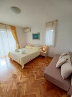 Posteľ alebo postele v izbe v ubytovaní Apartments Amor