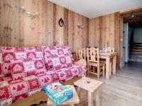 a living room with a couch and a table at Appartement Les Menuires, 2 pièces, 5 personnes - FR-1-344-855 in Les Menuires