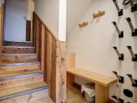 a room with wooden stairs and a wooden bench at Appartement Les Menuires, 2 pièces, 5 personnes - FR-1-344-855 in Les Menuires