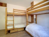 a bedroom with two bunk beds and a bed at Appartement Les Menuires, 2 pièces, 5 personnes - FR-1-344-855 in Les Menuires