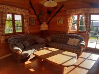 a living room with two couches and a coffee table at Schönberghütte in Lachtal