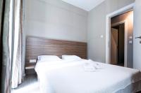 Posteľ alebo postele v izbe v ubytovaní Delmare MQUEEN Apartment