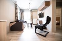 Televízia a/alebo spoločenská miestnosť v ubytovaní Delmare MQUEEN Apartment