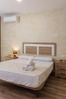 Posteľ alebo postele v izbe v ubytovaní Apartamentos Lola Beach