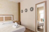 Posteľ alebo postele v izbe v ubytovaní Apartamentos Lola Beach