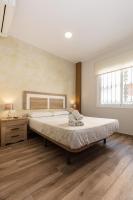 Posteľ alebo postele v izbe v ubytovaní Apartamentos Lola Beach