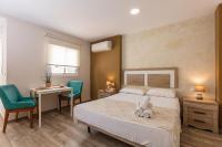 Posteľ alebo postele v izbe v ubytovaní Apartamentos Lola Beach