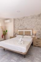 Posteľ alebo postele v izbe v ubytovaní Apartamentos Lola Beach