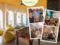 a collage of pictures on a table in a room at Wonderloft Hostel Kota Tua in Jakarta