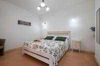 A bed or beds in a room at Arbor Exclusive B&B