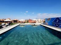 a swimming pool on the roof of a building at Stars Hotel &amp; Spa in Marrakech