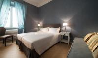 Łóżko lub łóżka w pokoju w obiekcie San Giuliano Inn