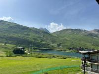 a view of a lake and a mountain at Duplex 65 m2 au coeur du golf de Tignes in Tignes