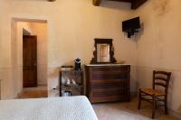 Televízia a/alebo spoločenská miestnosť v ubytovaní Agriturismo Tenuta Roccaccia
