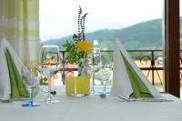 a table with wine glasses on a white table at DEVA Hotel Renchtalblick in Oberkirch