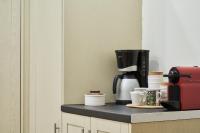 Coffee and tea making facilities at Spirou Merkouri Handcrafted 2BD Home