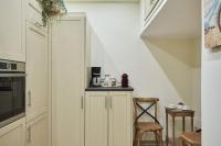 A kitchen or kitchenette at Spirou Merkouri Handcrafted 2BD Home